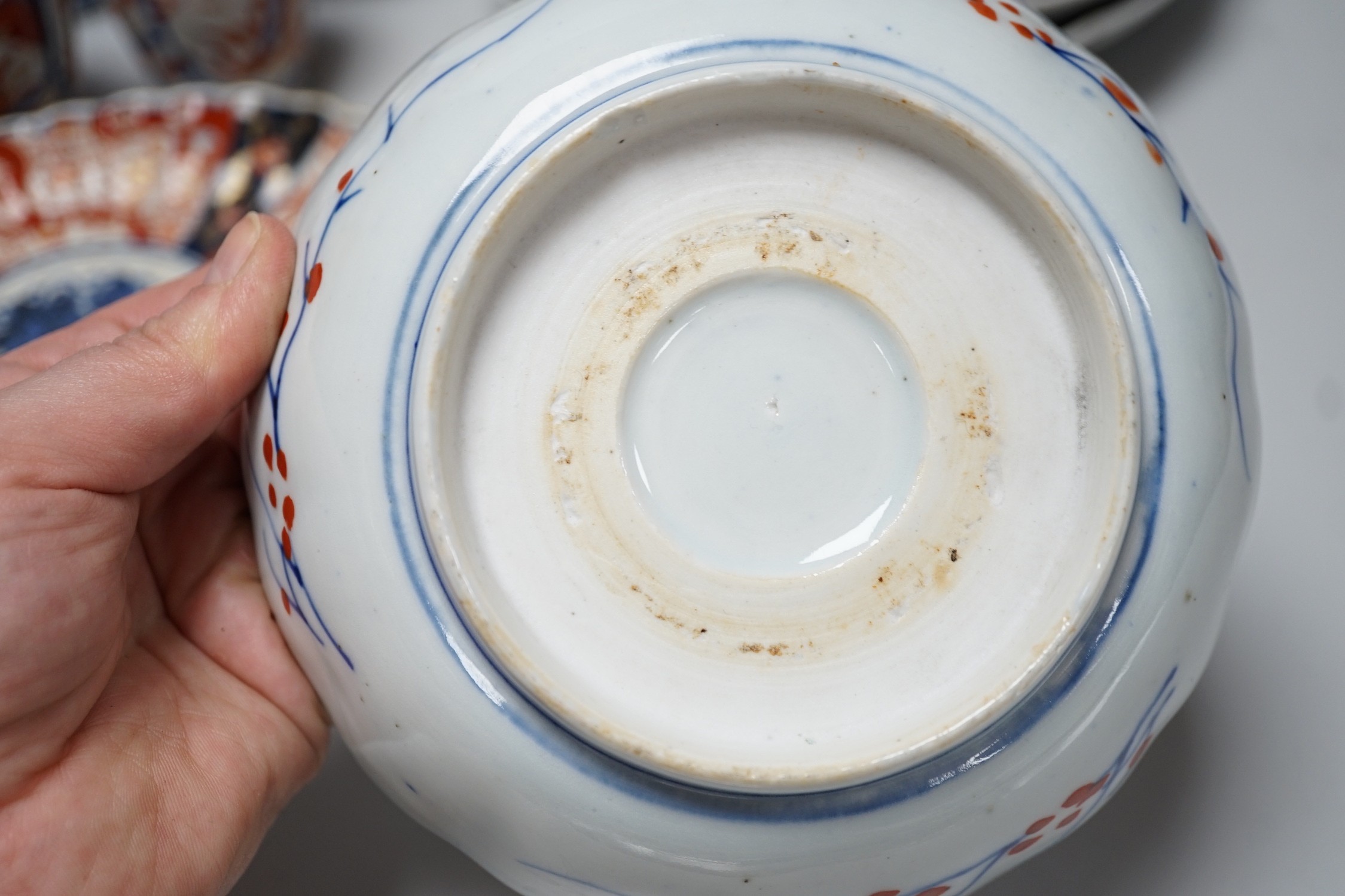 A group of Imari vases and dishes, tallest 19cm